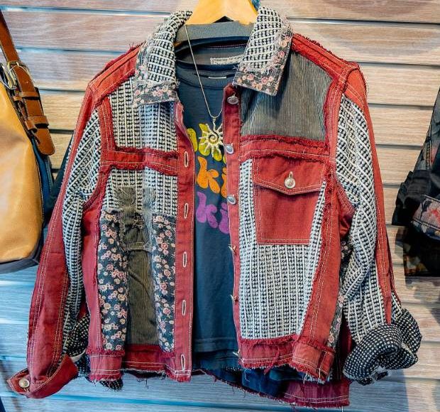 A patchwork jacket in red denim, black-and-white weave, and tiny florals